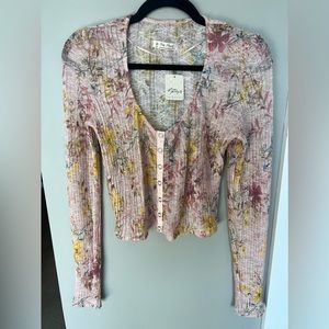 Free People mesh pink floral top with snap closure buttons.
